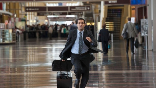 Hispanic business traveler running in airport