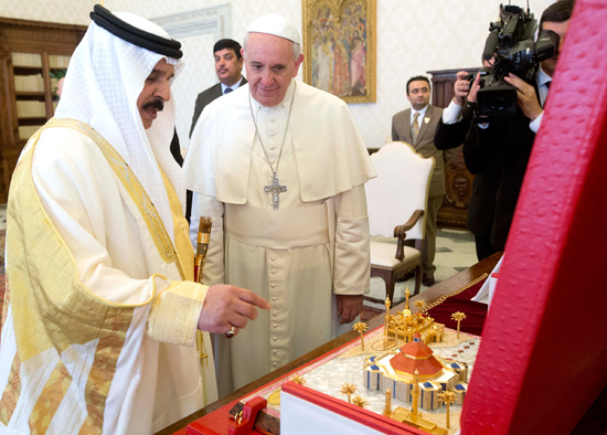 Pope Francis is presented with a gift from King Hamad bin Isa Al Khalifa of Bahrain during a meeting at the Vatican May 19.