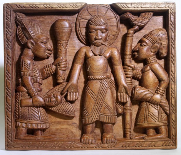 Transfiguration. carved wooden panel by lamidi Fakeye, from the collection of Drs. Nicholas Bridger and Sue Yoes